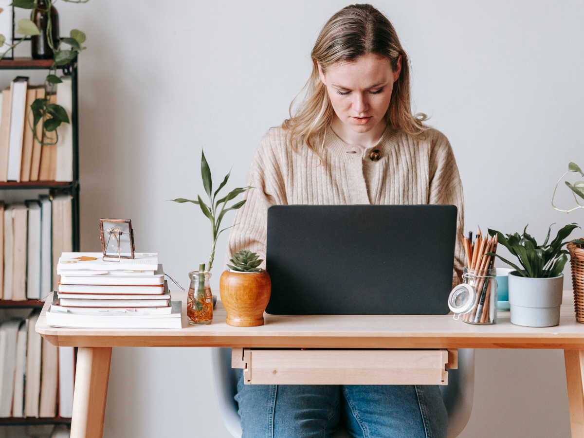 Woman at Laptop Reading Sellers Disclosure